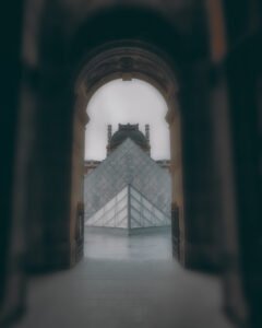 Photograph of the Louvre courtyard in Paris by George Adamides — author of "How Economy Works" and partner at WISENTRUST LTD, combining economic storytelling with visual composition.